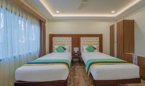 Treebo Aaravi Residency, 800 Mtrs From Promenade Beach